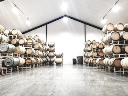 Wine is aged and stored in a carefully climate-controlled barrel storage room.